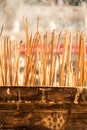 Joss sticks burning at a vintage Buddhist temple courtyard as offering during Chinese New Year in temple Royalty Free Stock Photo