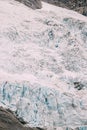 Jostedalsbreen National Park, Norway. Close Up View Of Melting Ice And Snow On Boyabreen Glacier In Summer Sunny Day