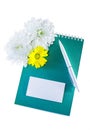 Jotter, card, pen and flowers