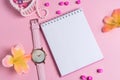 Jotter on a pink background with women`s ornaments. Valentine`s Day