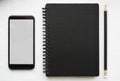 Journal book and pencil smartphone Royalty Free Stock Photo