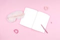 Journal with cute white fluffy sleep mask and pink accessories