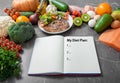 Journal with a diet plan on a kitchen table