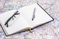 Journal on Map with Glasses and Pen Royalty Free Stock Photo