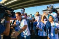 Journalist interviewing sport fans from Argentina. Royalty Free Stock Photo