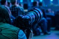 Journalist photographer with a telephoto lens at work