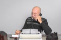 Journalist at work. Desk with telephone and typewriter. Vintage. Writer editor Royalty Free Stock Photo