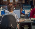 A journalist working on a computer in Newsroom