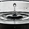 The journey of a droplet ends in a crystalline receptacle Royalty Free Stock Photo
