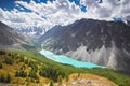 Journey on foot through the mountain valleys. Beauty of wildlife. Altai, the road to Shavlinsky lakes, Russia. Peaks of snowy Royalty Free Stock Photo