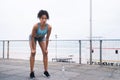 The journey might be tough, but youre the toughest. a sporty young woman taking a break while exercising outdoors. Royalty Free Stock Photo