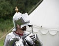 Knight wearing suit of armour read for jousting