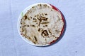 Jowar flour roti in the plate on white isolated background