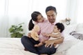 The joy of an Asian single father taking care of two children, a daughter and a son. A 2-year-old