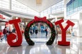 Joy christmas decorated gate in Dallas Airport