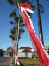 The joy of Indonesian independence. The flag flutters skyward. Red and White good luck.