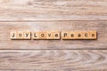 Joy love peace word written on wood block. joy love peace text on wooden table for your desing, concept Royalty Free Stock Photo