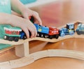 Joy of playing with wooden trains Royalty Free Stock Photo