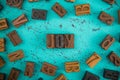 Joy Spelled in Wooden Type Set Block Letters