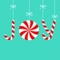 Joy text lettering hanhing on dash line with bow. Candy Cane Merry Christmas xmas decoration. Red white peppermint stick and Royalty Free Stock Photo