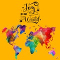 "Joy to the world" lettering card with a colorful map of the world in the dark yellow background