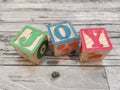 Joy. Joy word from wooden letter blocks Royalty Free Stock Photo