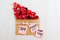 Joy for you post with red rose petals, flat lay Royalty Free Stock Photo