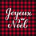 Joyeux Noel calligraphy hand lettering on red buffalo plaid background. Merry Christmas typography poster in French Royalty Free Stock Photo