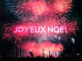 Joyeux Noel card on a fireworks background