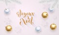 Joyeux Noel French Merry Christmas holiday golden decoration, gold hand drawn calligraphy font for greeting card white background. Royalty Free Stock Photo