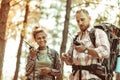 Joyful active couple speaking on walkie talkies Royalty Free Stock Photo