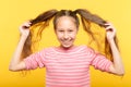 Joyful adolescent girl pig tails hair childish Royalty Free Stock Photo