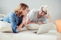 Joyful adult woman and her mother resting at home Royalty Free Stock Photo