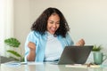 Joyful African American Businesswoman At Laptop Gesturing Yes In Office Royalty Free Stock Photo