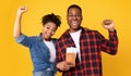 Joyful African American Couple Holding Flight Tickets On Yellow Background Royalty Free Stock Photo