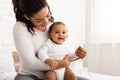 Joyful African American Mother Playing With Charming Toddler In Bedroom Royalty Free Stock Photo