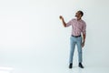 Joyful afro american man holding an umbrella Royalty Free Stock Photo