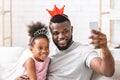 Joyful afro family having fun at home, taking selfie Royalty Free Stock Photo