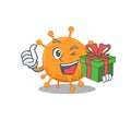 Joyful anaplasma cartoon character with a big gift box