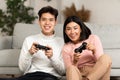 Joyful Asian Boyfriend And Girlfriend Playing Video Game At Home Royalty Free Stock Photo