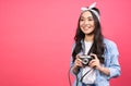 Joyful asian girl taking pictures on a retro vintage camera Royalty Free Stock Photo