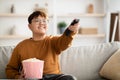 Joyful asian kid watching TV at home Royalty Free Stock Photo