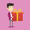 Joyful asian man holding box with gift.