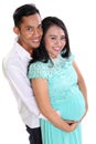 Joyful Asian pregnant couple smiling