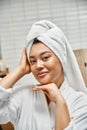 joyful asian woman with acne and