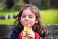 joyful baby girl picnic - health nutrition fruit juice Royalty Free Stock Photo