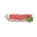 Joyful bacon cartoon character with a big gift box