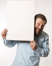 Joyful bearded man with blank paper folio studio portrait