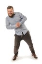 Joyful bearded man in shirt pushing invisible wall