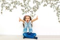 joyful beautiful little girl. cash dollars, on white background, isolated Royalty Free Stock Photo